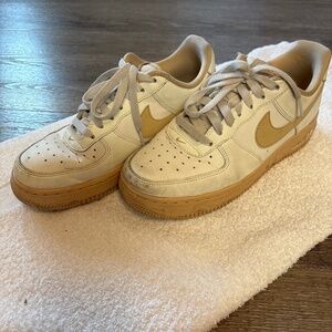 Beige and white Nike Air Forces